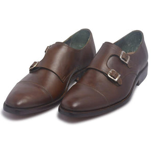 two monk strap leather shoes in brown color