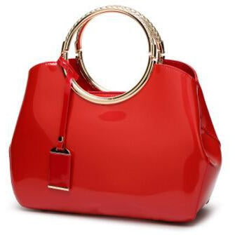 Women Shiny Glossy Faux-Leather Handbag with a Decorative Brass Buckle