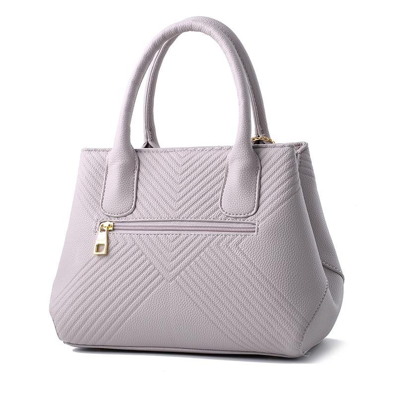 Women Quilted Faux-Leather Handbag with a Heart Shaped Tassel