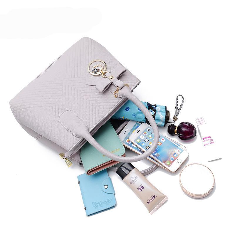 Women Quilted Faux-Leather Handbag with a Heart Shaped Tassel