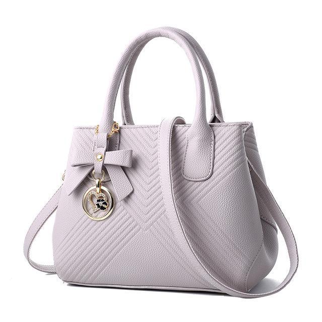 Women Quilted Faux-Leather Handbag with a Heart Shaped Tassel