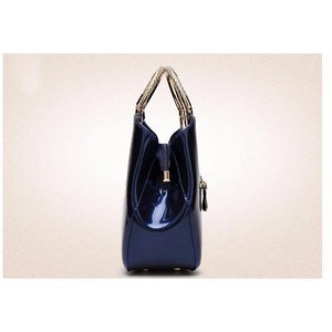 Women Shiny Glossy Faux-Leather Handbag with a Decorative Brass Buckle